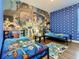 A bedroom is decorated with bright colors and themed bedding, creating a fun and playful atmosphere at 370 Pendant Ct, Kissimmee, FL 34747