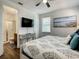 Bedroom features a queen bed, TV, and en suite bathroom with a shower at 370 Pendant Ct, Kissimmee, FL 34747