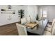 Dining room with modern furnishings, a long glass table, and nautical wall decorations at 370 Pendant Ct, Kissimmee, FL 34747