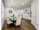 Open-concept dining room with sleek flooring, and stairs leading to the upper level at 370 Pendant Ct, Kissimmee, FL 34747