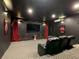 Home theater boasts comfortable seating, a large screen, and moody lighting at 370 Pendant Ct, Kissimmee, FL 34747