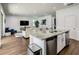 Modern kitchen island with granite countertops and stainless steel appliances at 370 Pendant Ct, Kissimmee, FL 34747