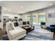 Spacious living room boasts a sectional sofa, area rug, and sliding doors to the pool and backyard at 370 Pendant Ct, Kissimmee, FL 34747
