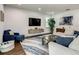 Bright living room featuring stylish furnishings, decor, and a large flat screen television at 370 Pendant Ct, Kissimmee, FL 34747
