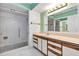 Bathroom featuring long vanity, tile flooring, mirror and walk in shower at 380 Violet Dell Dr, Casselberry, FL 32707