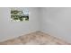 Bedroom featuring neutral tile flooring and a window for natural light at 380 Violet Dell Dr, Casselberry, FL 32707