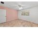 Bedroom featuring neutral tile flooring, window, and a ceiling fan at 380 Violet Dell Dr, Casselberry, FL 32707