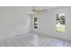Bright bedroom with two windows and a view of the street at 380 Violet Dell Dr, Casselberry, FL 32707