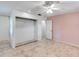Spacious bedroom featuring tile flooring, closet space and a ceiling fan at 380 Violet Dell Dr, Casselberry, FL 32707