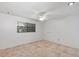 Bedroom with tile flooring, ceiling fan and a window for natural light at 380 Violet Dell Dr, Casselberry, FL 32707
