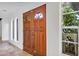 The front entry features a wood double door, neutral paint, and tile flooring at 380 Violet Dell Dr, Casselberry, FL 32707