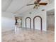 Bright, open living room featuring exposed beam ceiling and views of the lanai at 380 Violet Dell Dr, Casselberry, FL 32707
