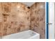 Tiled shower and tub combo with a modern shower head and tile surround at 380 Violet Dell Dr, Casselberry, FL 32707