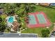 Aerial view of the community tennis courts and pool with lounge area for residents at 4018 August Ct, Casselberry, FL 32707