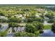 A scenic aerial view showcases the neighborhood surrounded by lush greenery and trees at 4018 August Ct, Casselberry, FL 32707