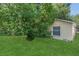 This house is complimented by a grassy backyard with mature trees at 4018 August Ct, Casselberry, FL 32707