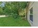 This house has a well kept lawn with mature trees in the backyard at 4018 August Ct, Casselberry, FL 32707
