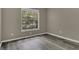 Bedroom featuring wood-look flooring and natural light at 4018 August Ct, Casselberry, FL 32707