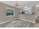 Dining room with hardwood floors and a view into the kitchen at 4018 August Ct, Casselberry, FL 32707