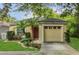 Charming single-story home featuring a well-maintained lawn and an attached two-car garage at 4018 August Ct, Casselberry, FL 32707