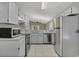 Kitchen with stainless steel appliances and tile flooring at 4018 August Ct, Casselberry, FL 32707