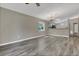 Open living room featuring hardwood floors, natural light, and ceiling fan at 4018 August Ct, Casselberry, FL 32707