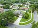 Overhead view of a home with a large, green lawn, and mature trees at 4478 Yachtmans Ct, Orlando, FL 32812