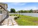 Large, well-manicured backyard with a spacious lawn and a privacy fence at 4478 Yachtmans Ct, Orlando, FL 32812
