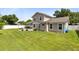 Beautiful backyard with a spacious lawn and a charming patio area at 4478 Yachtmans Ct, Orlando, FL 32812