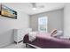 Cozy bedroom featuring a ceiling fan, a modern dresser and a TV for relaxation at 4478 Yachtmans Ct, Orlando, FL 32812
