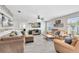 Comfortable living room featuring hardwood floors, comfortable seating, and a mounted television at 4478 Yachtmans Ct, Orlando, FL 32812