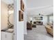 Open-concept view of the living room, half-bath, and modern hard wood floors at 4478 Yachtmans Ct, Orlando, FL 32812