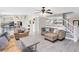 Spacious living room with hardwood floors and view of kitchen and a staircase at 4478 Yachtmans Ct, Orlando, FL 32812