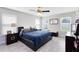 Spacious main bedroom features hard wood floors, a ceiling fan, and ample natural light at 4478 Yachtmans Ct, Orlando, FL 32812