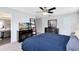 Main bedroom featuring a ceiling fan, two dressers, and an attached bathroom at 4478 Yachtmans Ct, Orlando, FL 32812