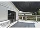 Outdoor patio area with sliding glass doors, nice sun shade, and views to the fenced back yard at 448 Stonewood Ln, Maitland, FL 32751