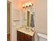 Bathroom featuring wood vanity, framed mirror and shower with decorative curtain at 448 Stonewood Ln, Maitland, FL 32751