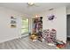 Playroom featuring hardwood floors, natural light, and a ceiling fan at 448 Stonewood Ln, Maitland, FL 32751