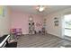 Bright bedroom with ceiling fan, hardwood floors, and ample space for a variety of activities at 448 Stonewood Ln, Maitland, FL 32751