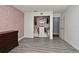 Bedroom features gray wood floors, rose-patterned accent wall, and walk-in closet at 448 Stonewood Ln, Maitland, FL 32751