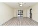 Bright bedroom with light gray floors, fan and slider to deck at 448 Stonewood Ln, Maitland, FL 32751