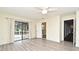 Bright bedroom featuring light gray floors, slider to deck and bathroom access at 448 Stonewood Ln, Maitland, FL 32751