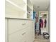 Walk-in closet with custom shelves and drawers, providing ample storage space at 448 Stonewood Ln, Maitland, FL 32751