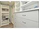 Walk-in closet with custom shelves and drawers, providing ample storage space at 448 Stonewood Ln, Maitland, FL 32751