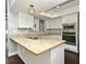 Bright kitchen featuring granite countertops, stainless steel appliances, and ample cabinet space at 448 Stonewood Ln, Maitland, FL 32751