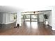 Spacious living area featuring ample windows, wood floors, and ceiling fans at 448 Stonewood Ln, Maitland, FL 32751
