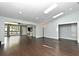 Open living area with large windows and wood floors at 448 Stonewood Ln, Maitland, FL 32751