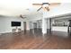 Spacious living room with hardwood floors, recessed lighting, and access to the kitchen area at 448 Stonewood Ln, Maitland, FL 32751