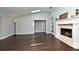 Living room featuring fireplace, skylights, and elegant wood floors at 448 Stonewood Ln, Maitland, FL 32751