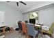 Cozy home office features a large window, modern desk, and a variety of seating options at 448 Stonewood Ln, Maitland, FL 32751